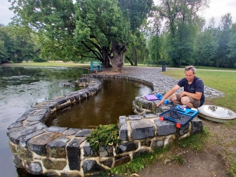 Photon Water quality monitoring sampling  at a water source 